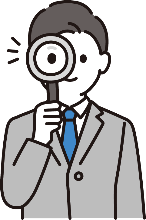 虫眼鏡を使う男性